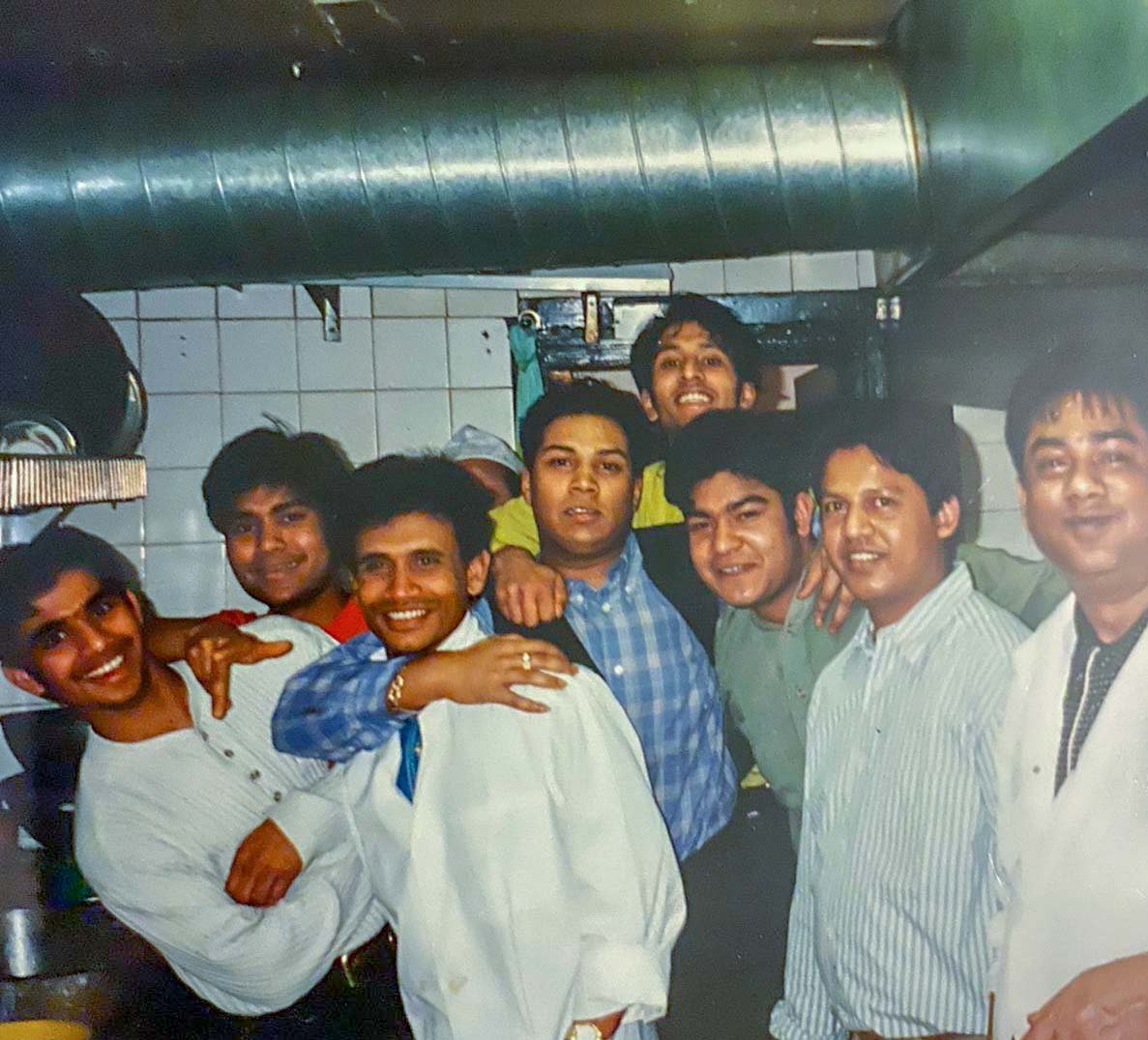 Staff gathered together inside the kitchen of the Rajpoot Tandoori in Salisbury